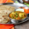 2 Pcs Pyaz Paratha Aloo Matar Gravy